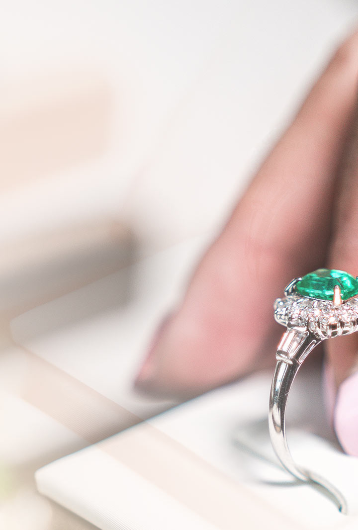 the edge of a diamond and emerald ring